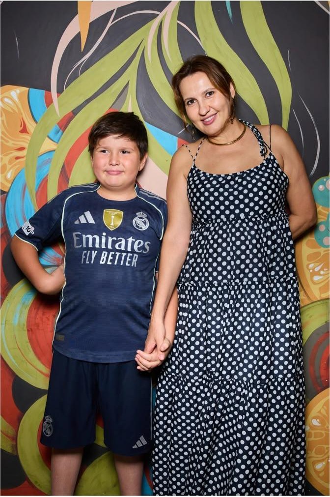Ioanna Ponomarenko with a child in a project-related family photo